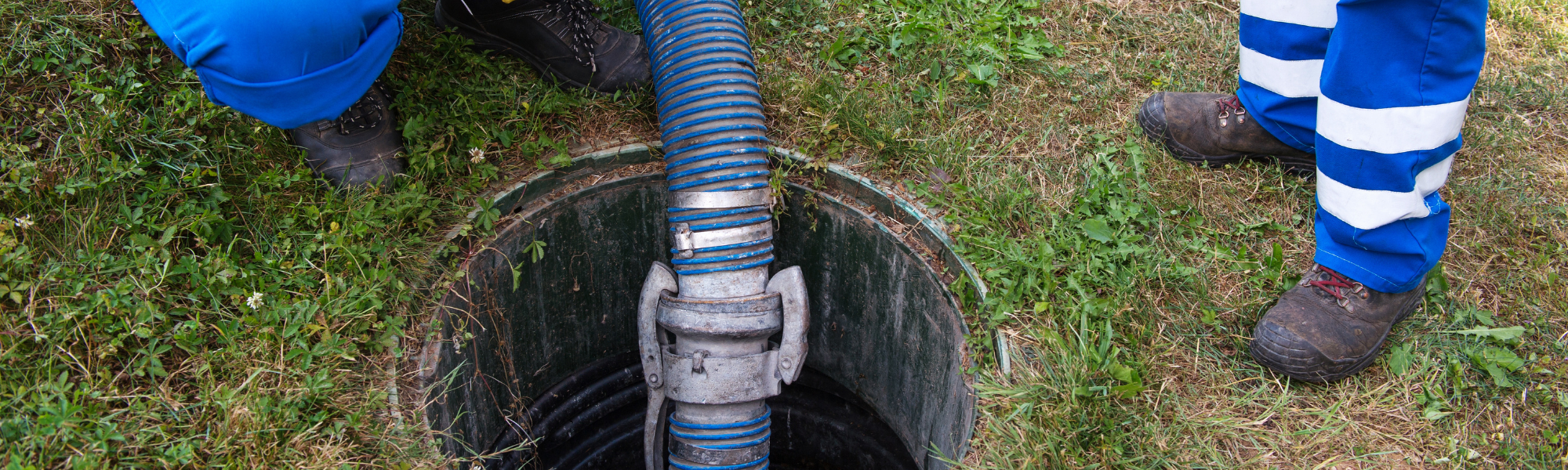 Guy Cleaning out Septic Tank with Hose